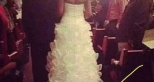 Noiva é criticada por amarrar filha de 1 mês em seu vestido de casamento
